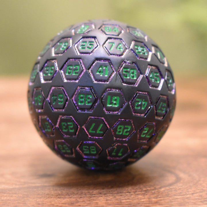 The Orb D100 -  Purple, Green, and Black Metal Die